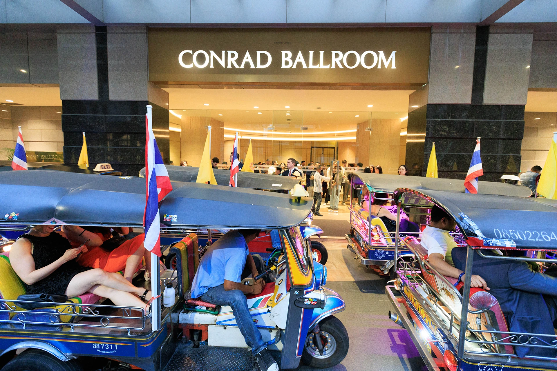 Corporate incentive travel tuk-tuk convoy arrival Bangkok